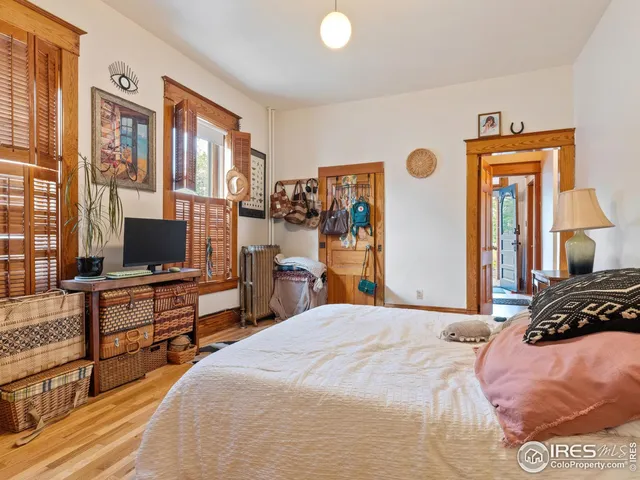 a bedroom with a bed and a television