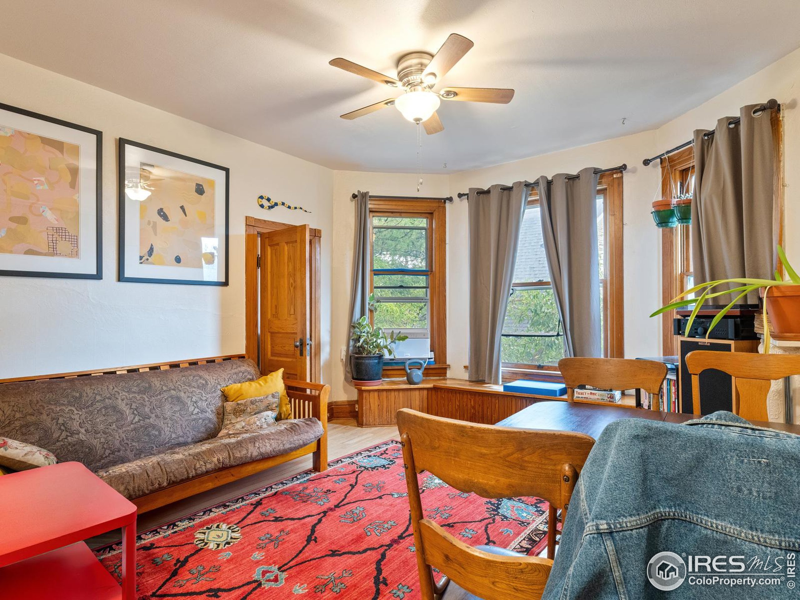 1828 Pine Street Boulder, CO 80302 - Photo 18 of 50 a living room with furniture and large windows