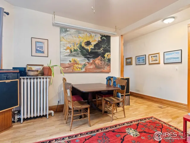 a view of a livingroom with furniture and workspace