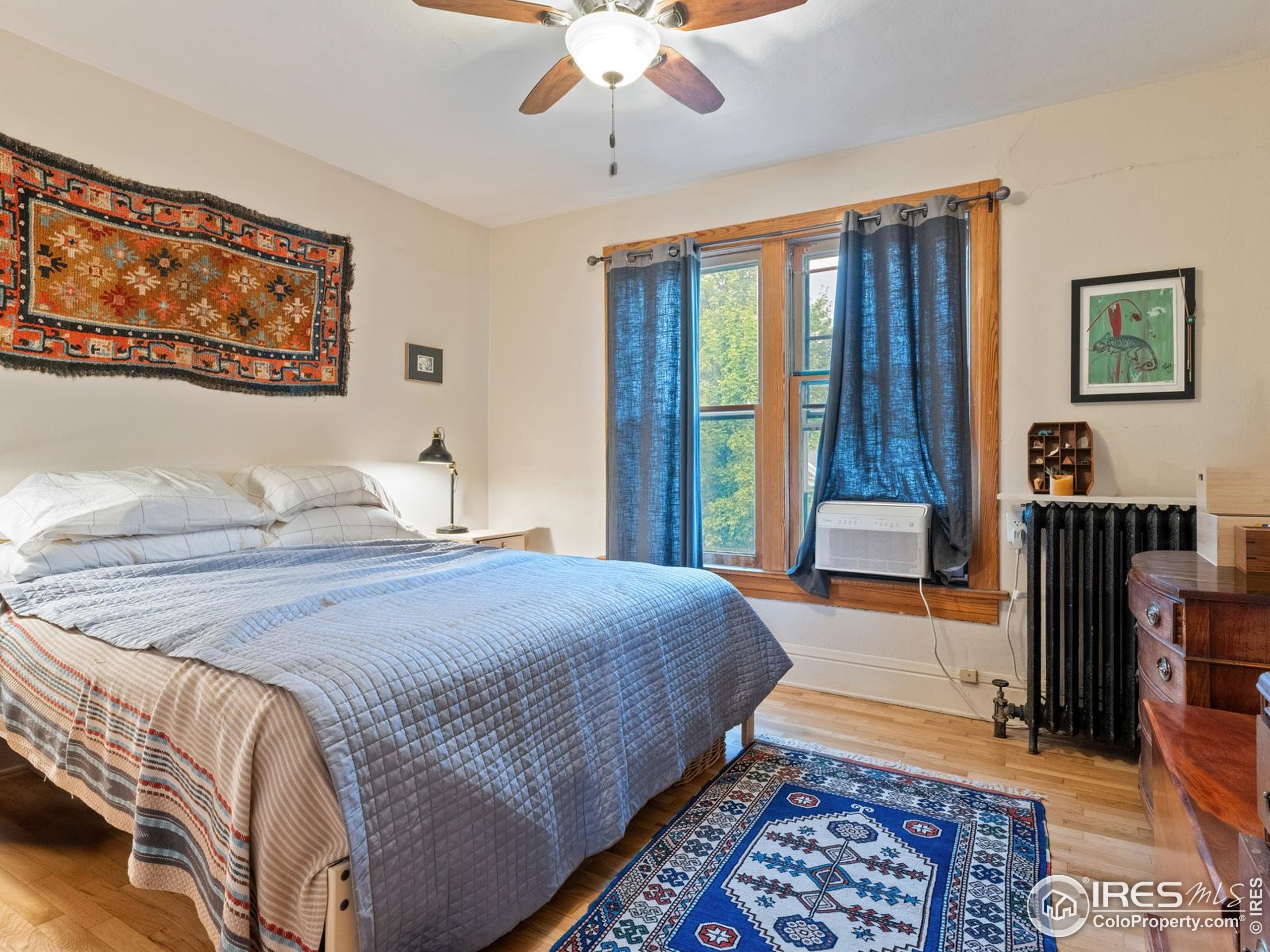 1828 Pine Street Boulder, CO 80302 - Photo 22 of 50 a bedroom with a bed and wooden floor