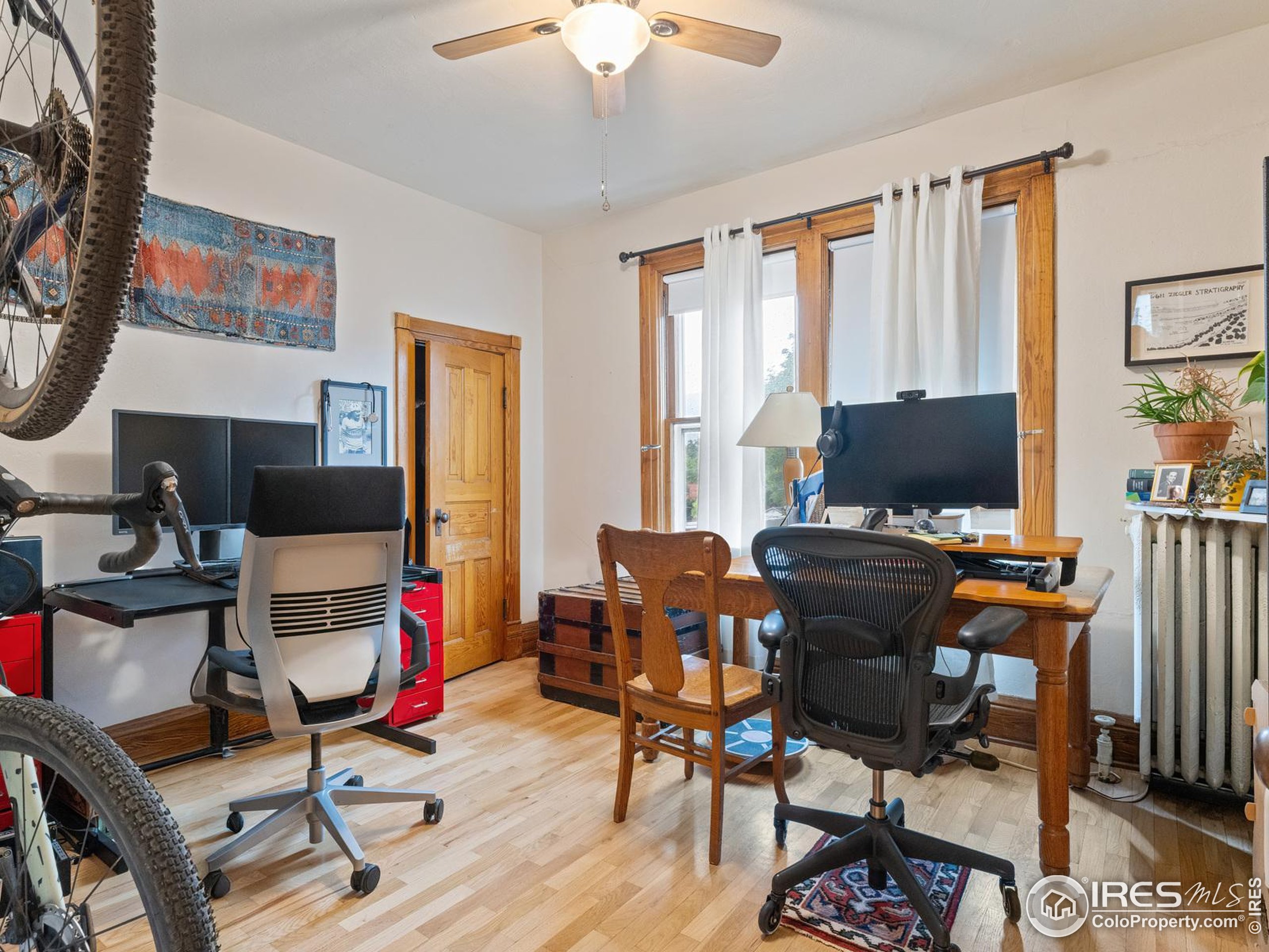 1828 Pine Street Boulder, CO 80302 - Photo 23 of 50 a workspace with furniture hardwood and a window