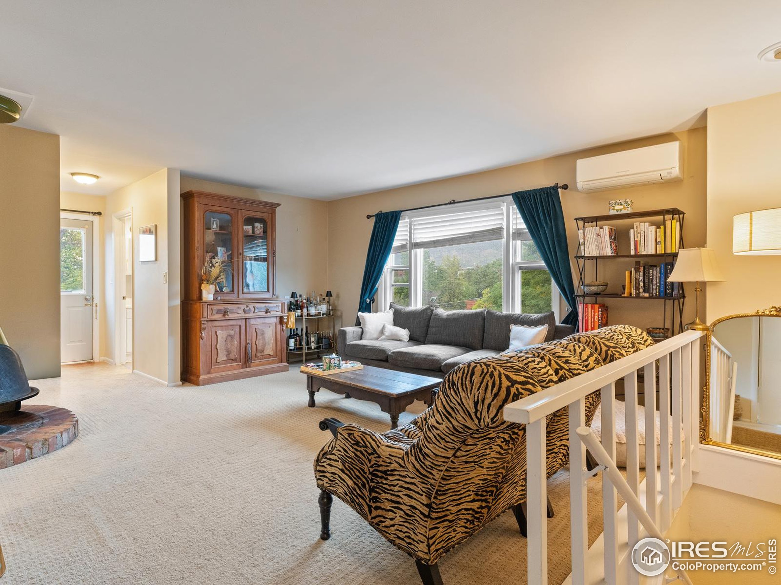 1828 Pine Street Boulder, CO 80302 - Photo 25 of 50 a living room with furniture floor to ceiling window and wooden floor