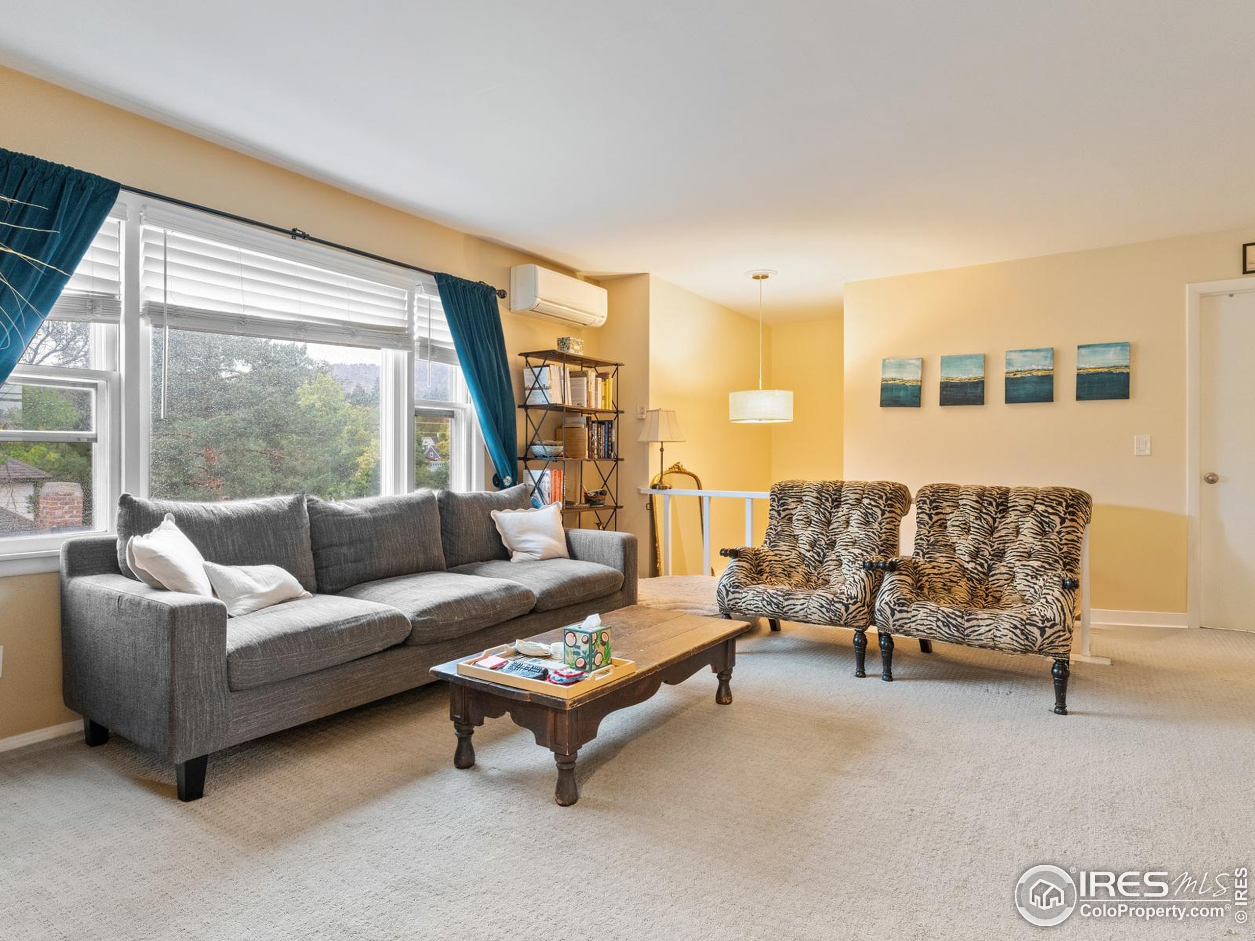 1828 Pine Street Boulder, CO 80302 - Photo 27 of 50 a living room with furniture and a large window