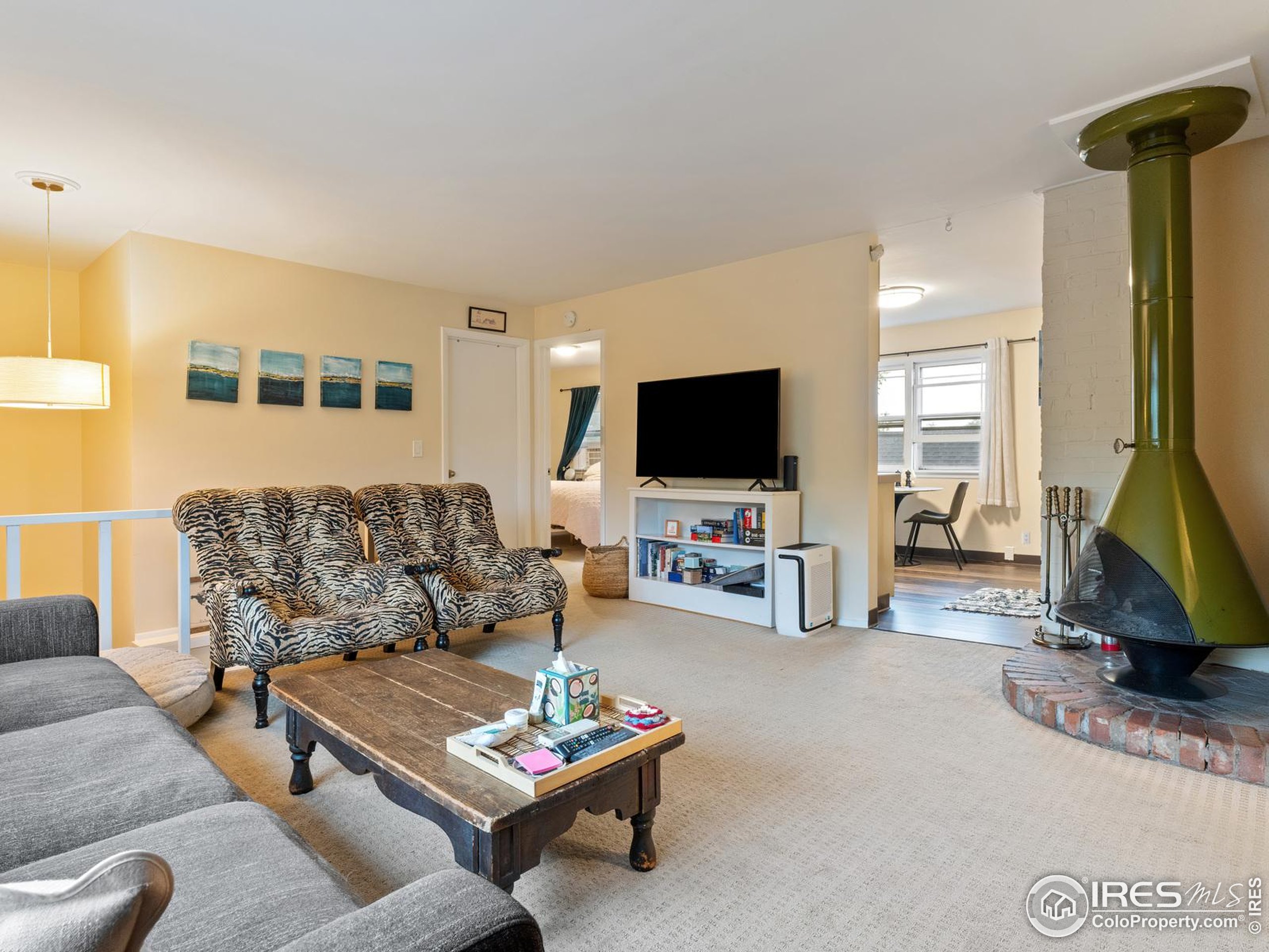 1828 Pine Street Boulder, CO 80302 - Photo 29 of 50 a living room with furniture and a flat screen tv