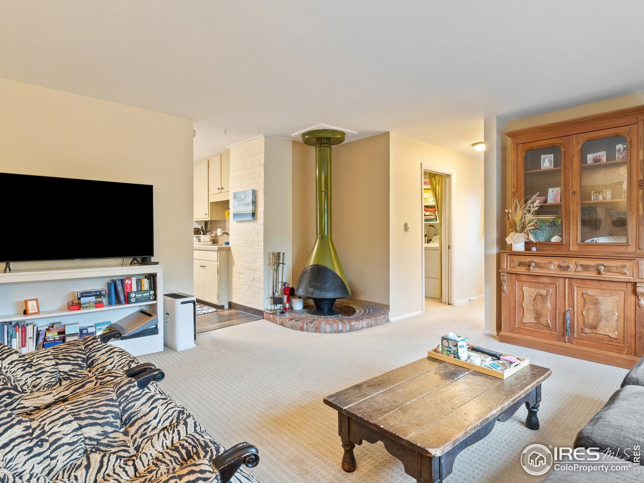 1828 Pine Street Boulder, CO 80302 - Photo 30 of 50 a living room with furniture and a flat screen tv