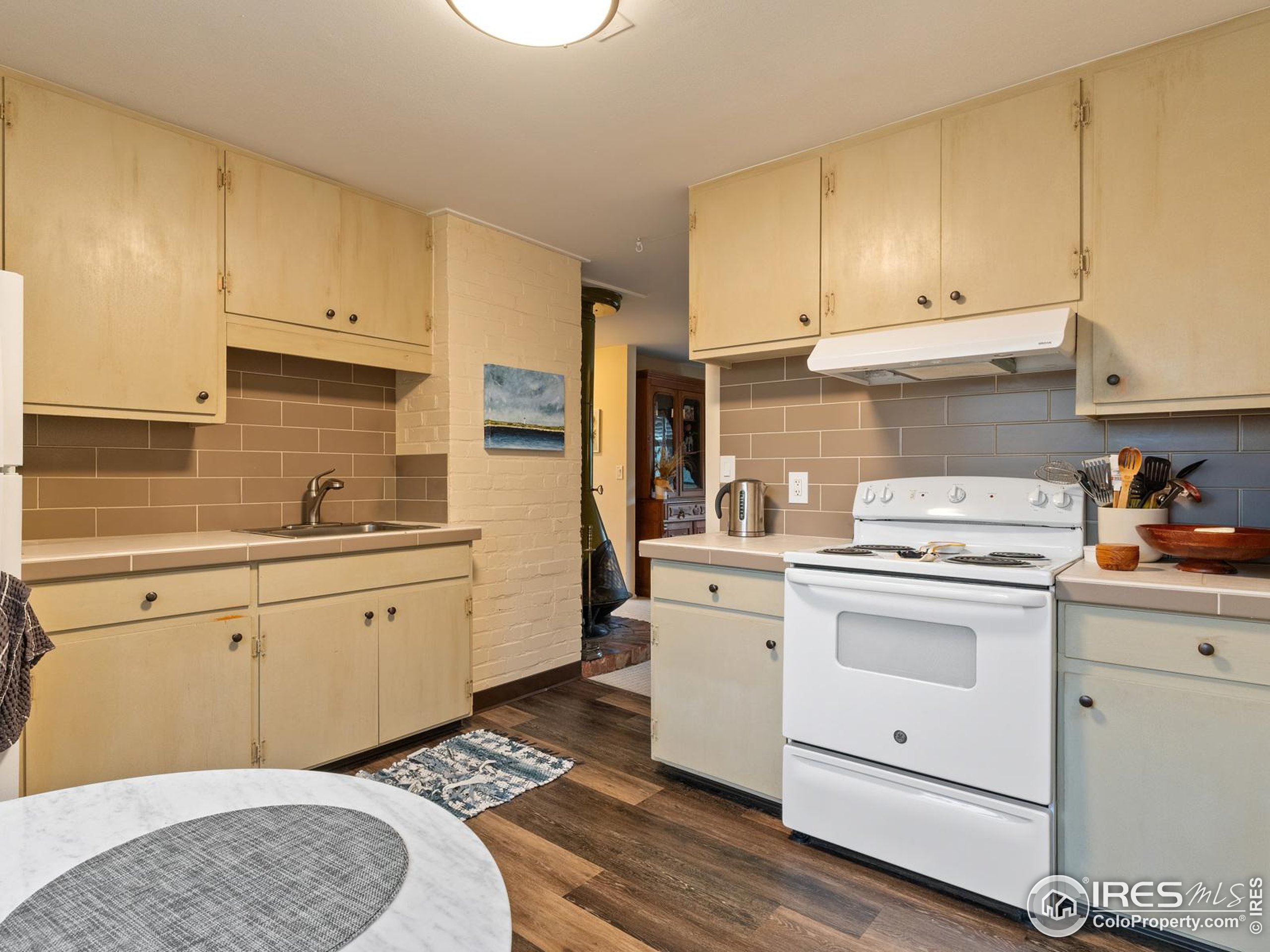 1828 Pine Street Boulder, CO 80302 - Photo 32 of 50 a kitchen with cabinets appliances and a sink
