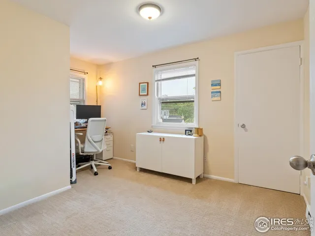 a room with a window and a chair