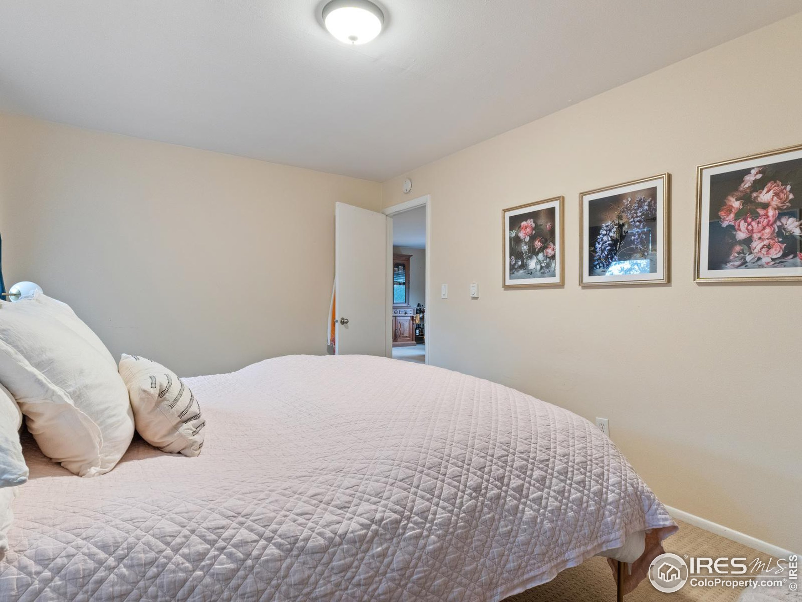 1828 Pine Street Boulder, CO 80302 - Photo 37 of 50 a bedroom with a bed and wall painting