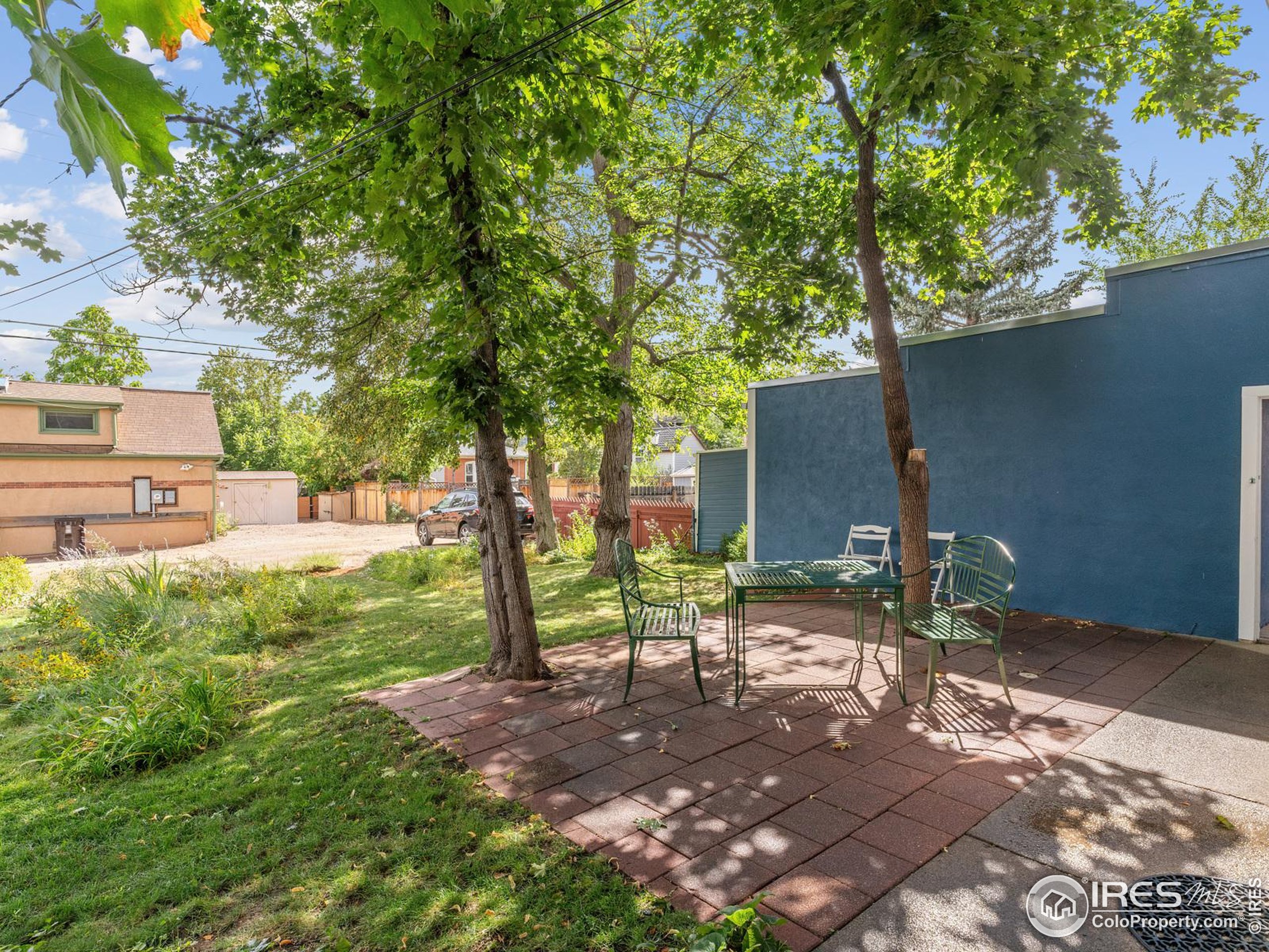 1828 Pine Street Boulder, CO 80302 - Photo 40 of 50 a backyard of a house with lots of green space