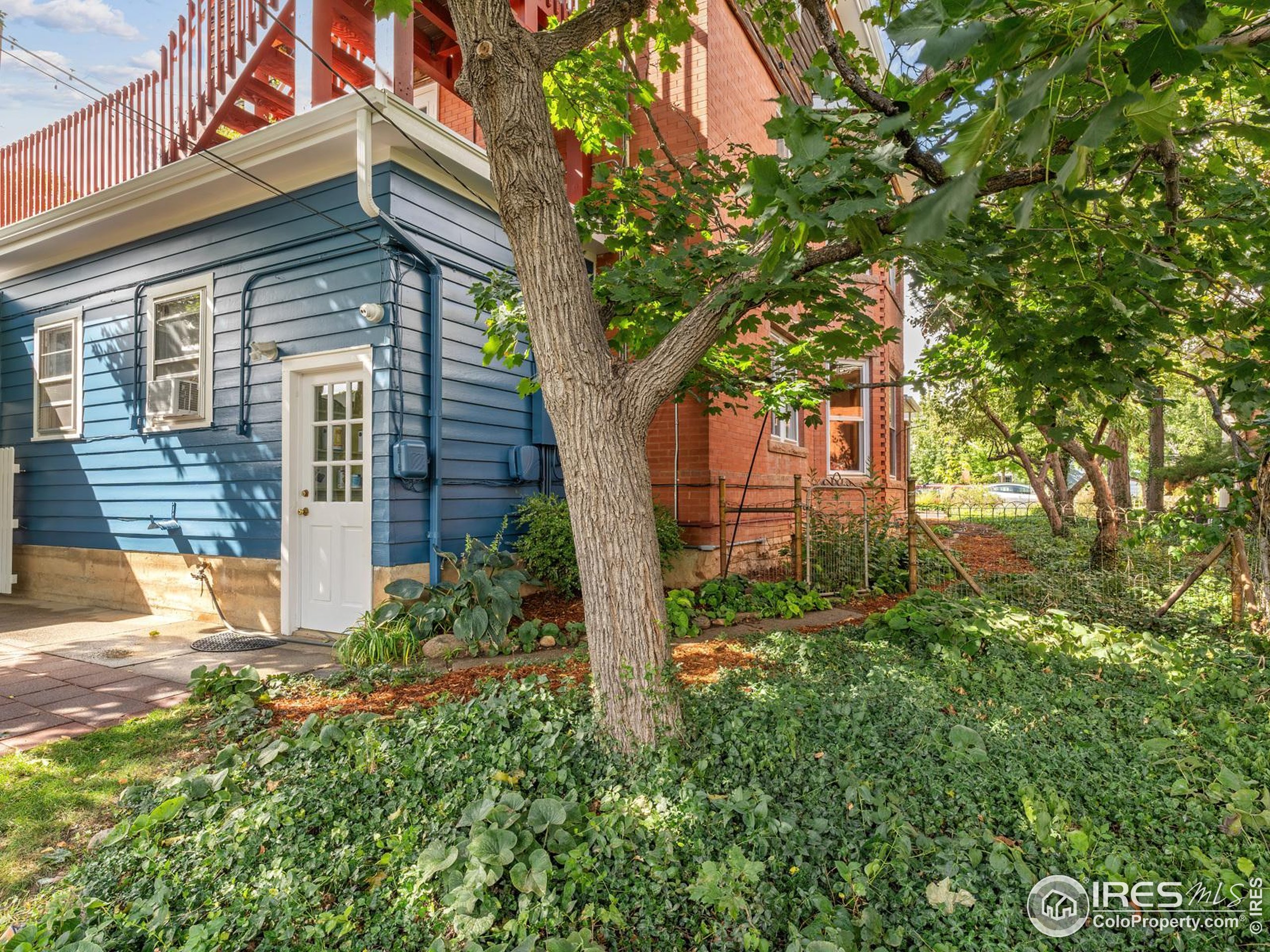 1828 Pine Street Boulder, CO 80302 - Photo 44 of 50 front view of a house with a tree