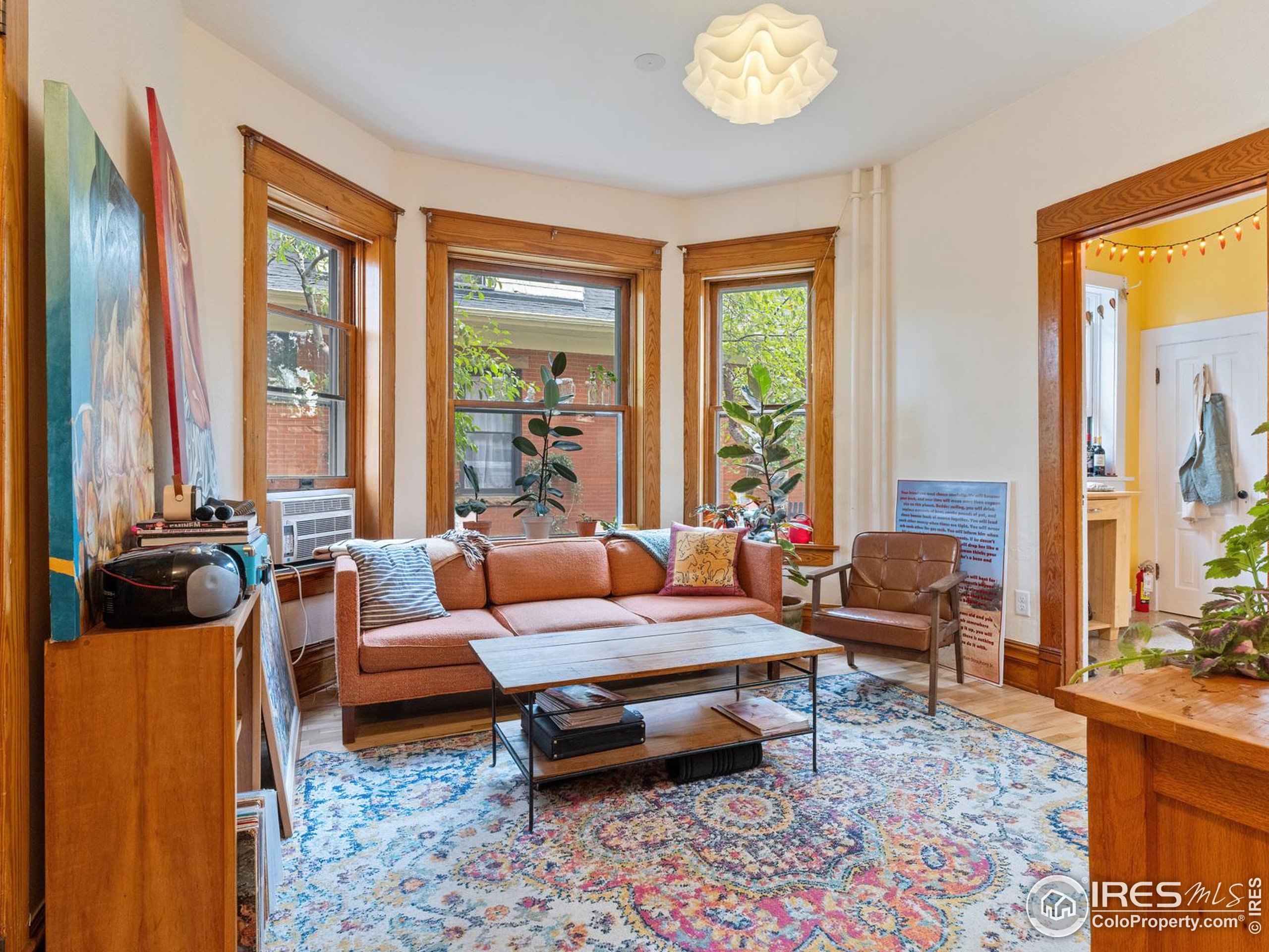 1828 Pine Street Boulder, CO 80302 - Photo 5 of 50 a living room with furniture and a large window