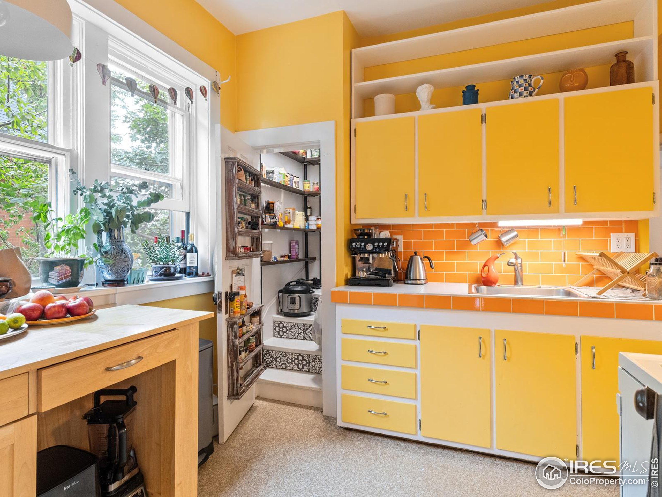 1828 Pine Street Boulder, CO 80302 - Photo 10 of 50 a utility room with stainless steel appliances a stove and a window