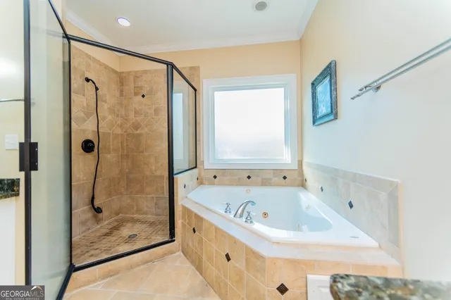 a bathroom with a tub and a sink
