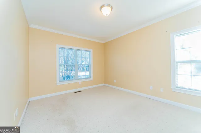 an empty room with windows