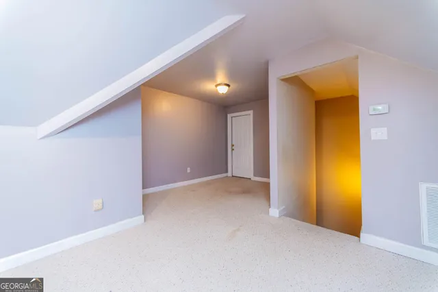 a view of a balcony with wooden floor and fence