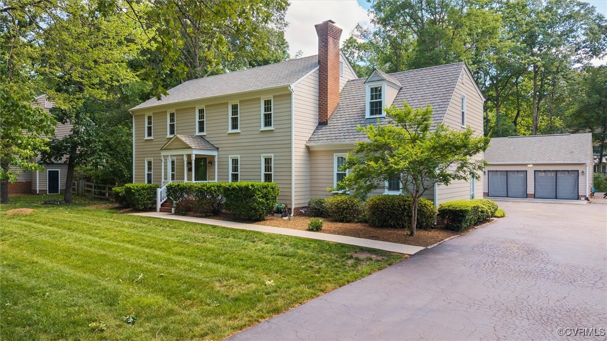 12711 Foxstone Road Midlothian, VA 23113 - Photo 2 of 50 a front view of a house with a yard and garage