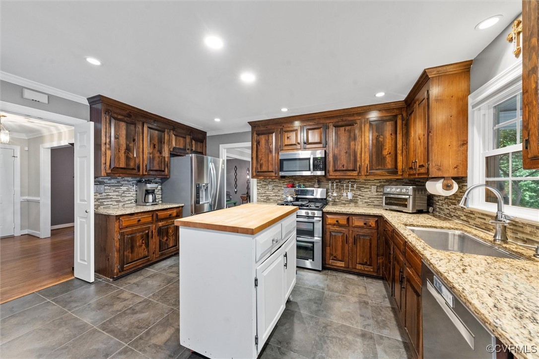 12711 Foxstone Road Midlothian, VA 23113 - Photo 24 of 50 a kitchen with stainless steel appliances granite countertop a stove top oven sink and cabinets