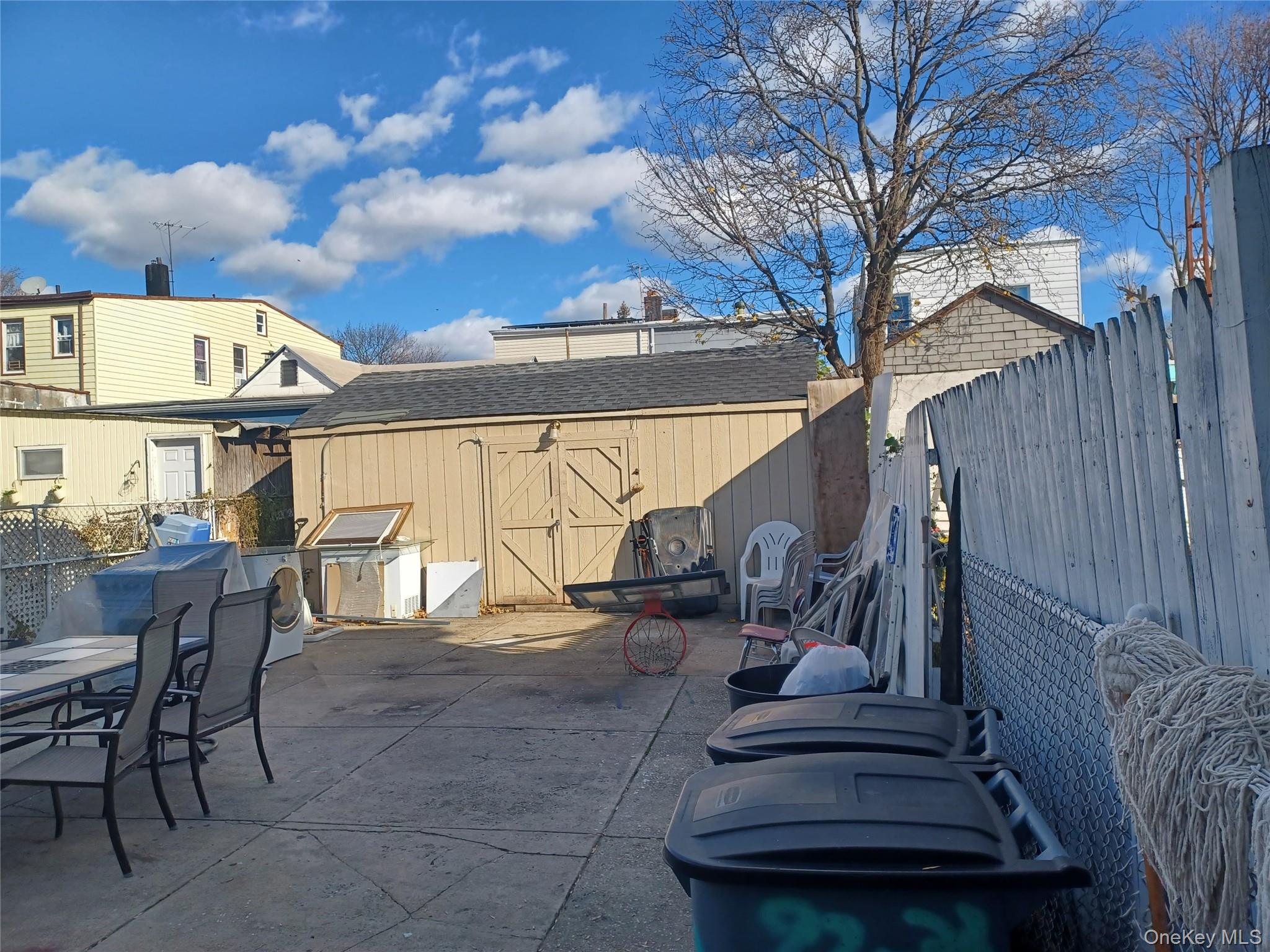 97-33 89th Street Queens, NY 11416 - Photo 3 of 13 a view of a house with backyard porch and sitting area