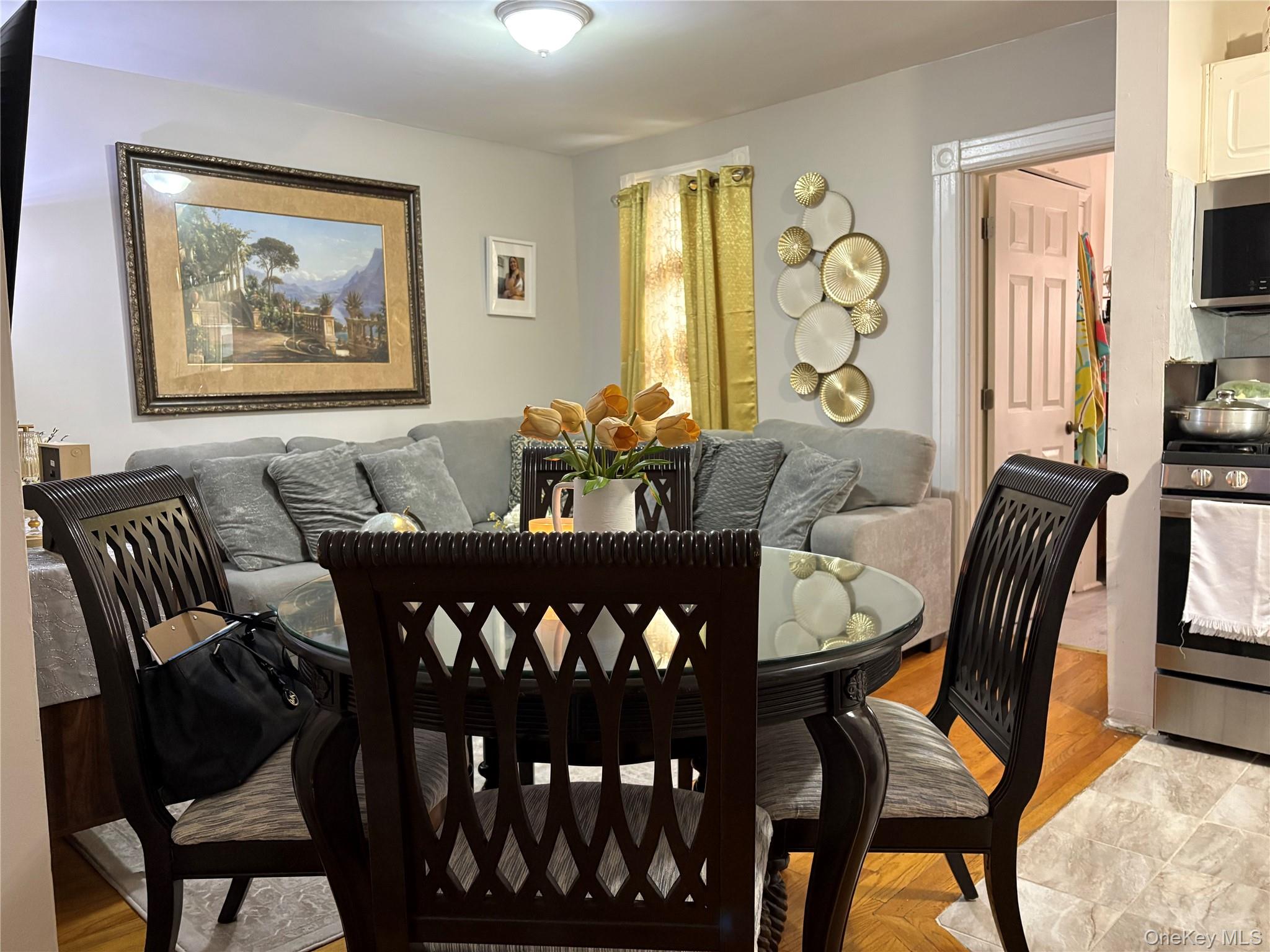 97-33 89th Street Queens, NY 11416 - Photo 6 of 13 a view of a dining room with furniture and window