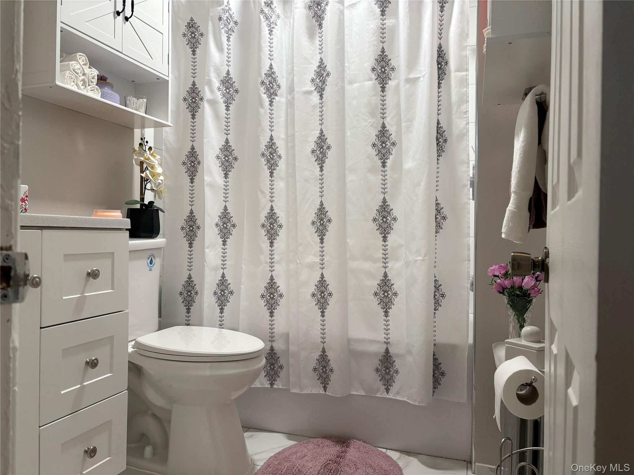 97-33 89th Street Queens, NY 11416 - Photo 10 of 13 a bathroom with a toilet and shower