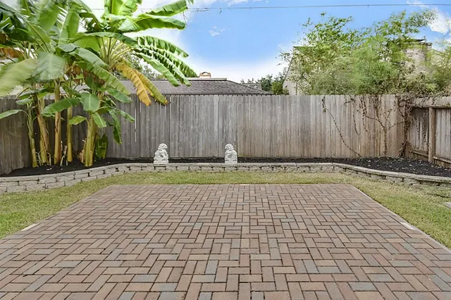 a front view of a building with a brick wall