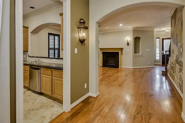 a view of a room with wooden floor