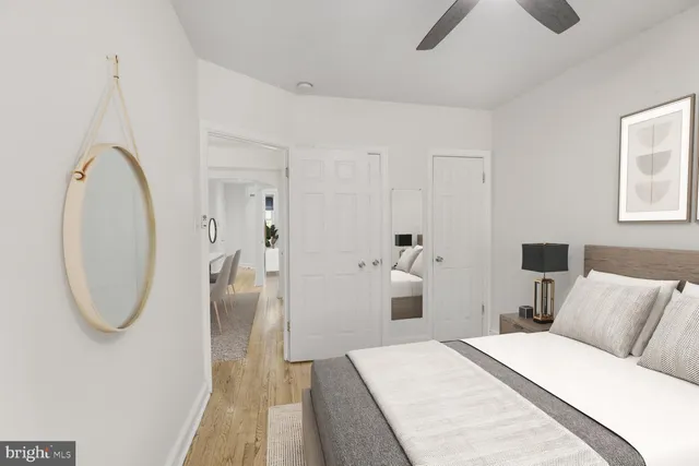 a bedroom with a bed and a mirror