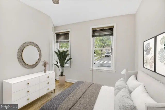 a bedroom with furniture and a window