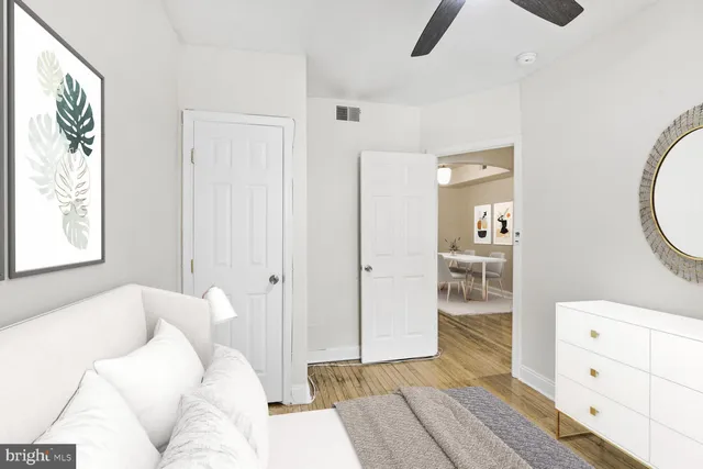 a bedroom with a bed and a view of bathroom