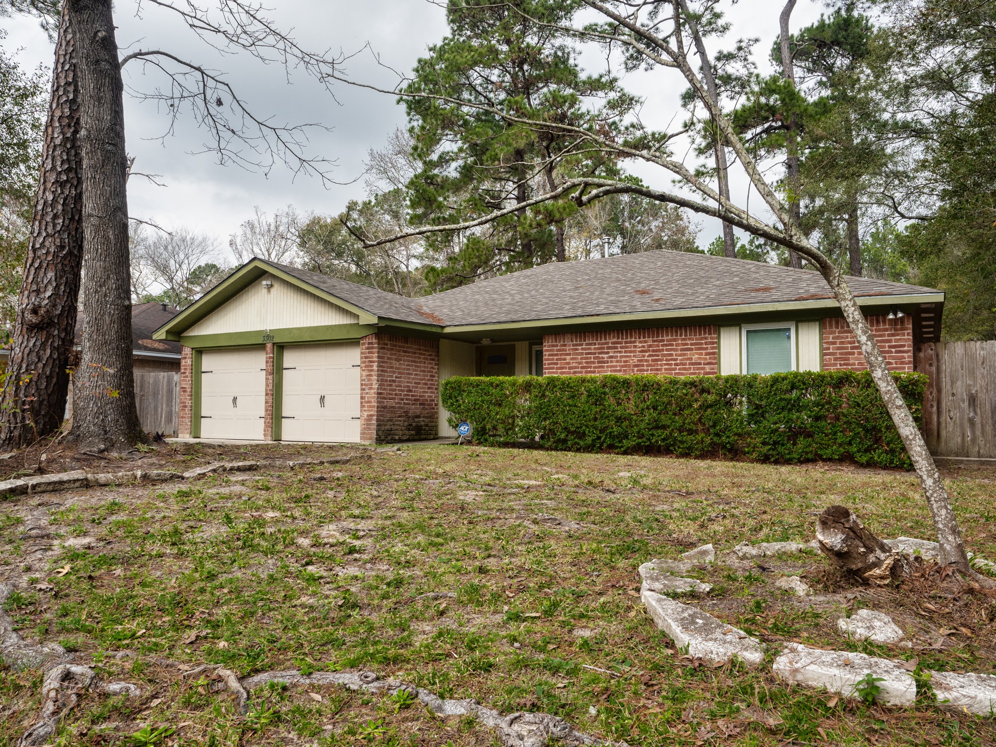 3302 Willie Way Spring, TX 77380 - Photo 2 of 25 a front view of a house with a garden