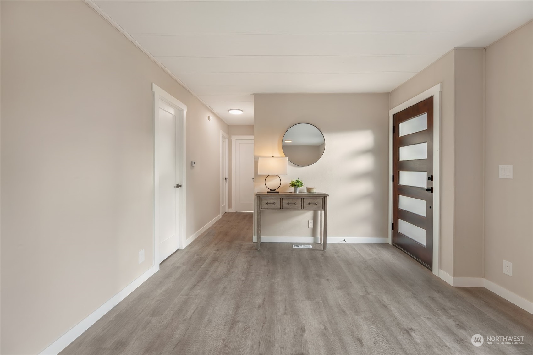 7020 187th Avenue Southwest Rochester, WA 98579 - Photo 19 of 40 a living room with furniture and a wooden floor
