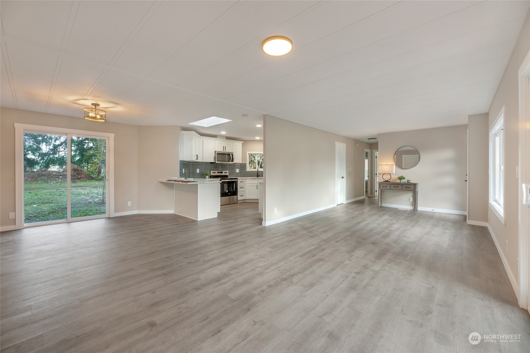 7020 187th Avenue Southwest Rochester, WA 98579 - Photo 21 of 40 a view of empty room with wooden floor and window