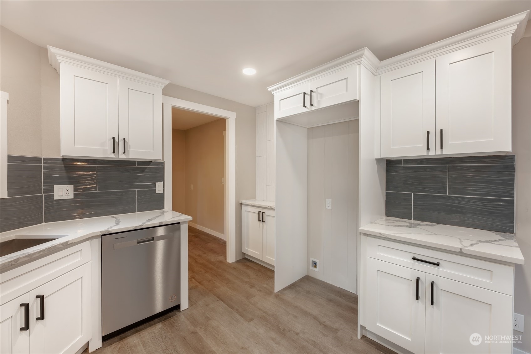 7020 187th Avenue Southwest Rochester, WA 98579 - Photo 28 of 40 a kitchen with white cabinets and sink