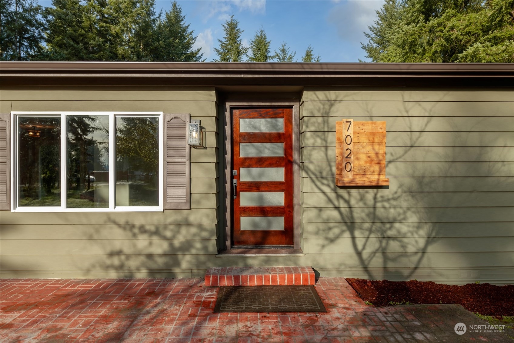 7020 187th Avenue Southwest Rochester, WA 98579 - Photo 3 of 40 a front view of a house with a yard