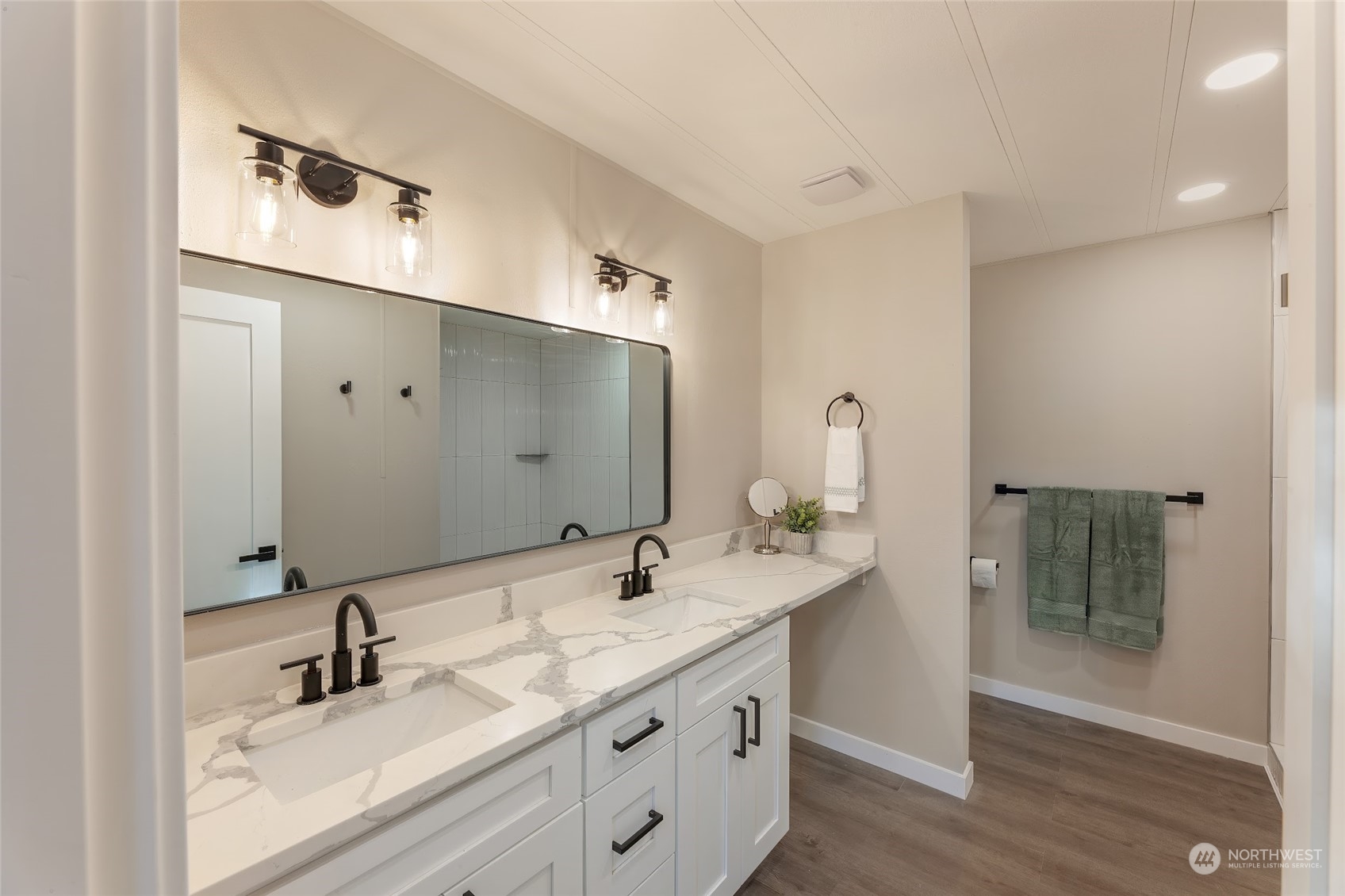 7020 187th Avenue Southwest Rochester, WA 98579 - Photo 33 of 40 a bathroom with a double vanity sink and mirror