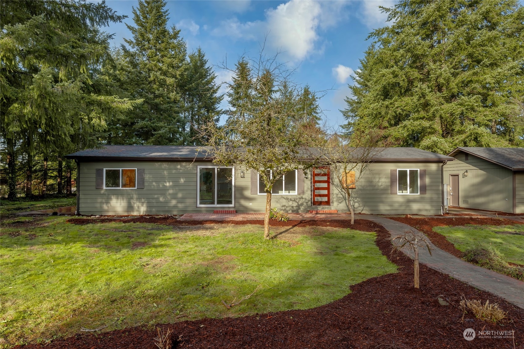 7020 187th Avenue Southwest Rochester, WA 98579 - Photo 5 of 40 a view of a house with a yard patio and fire pit