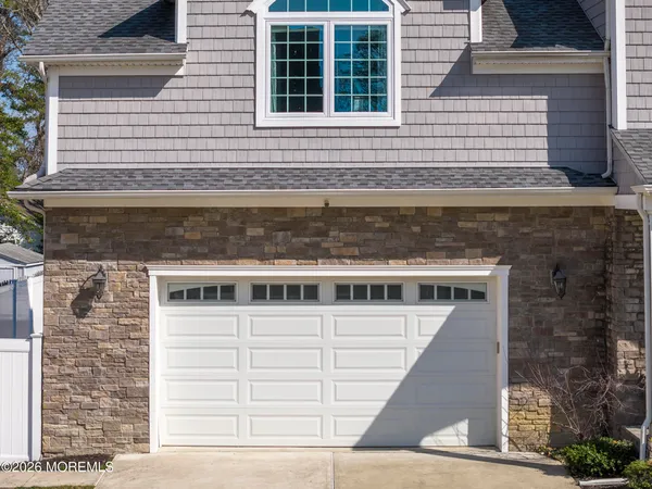 a dining room with furniture a rug and wooden floor