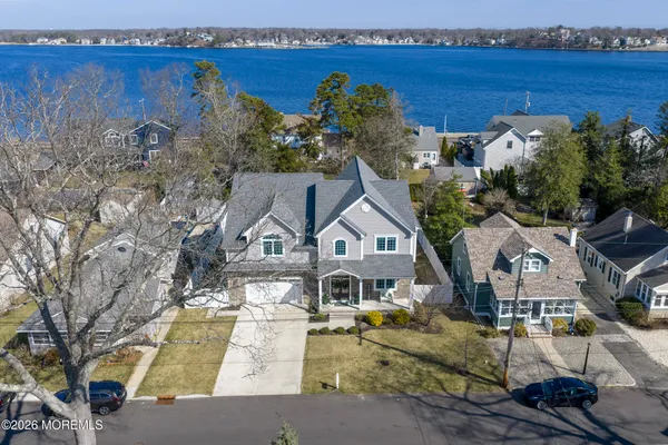 a view of entryway with wooden floor and front door