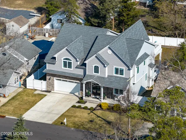 a bedroom with furniture and a flat screen tv