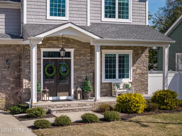an aerial view of a house with a lake view