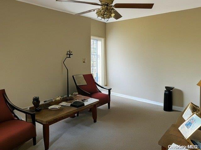 6748 Springfield Boulevard, Unit 1 Queens, NY 11364 - Photo 2 of 7 a room with furniture and chandelier