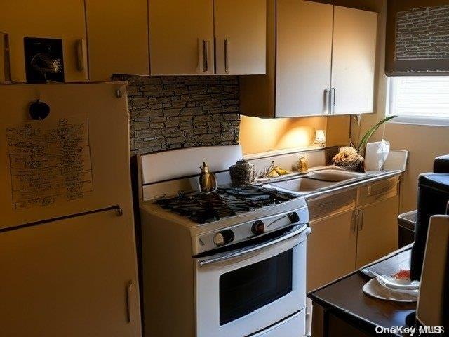 6748 Springfield Boulevard, Unit 1 Queens, NY 11364 - Photo 5 of 7 a stove top oven sitting inside of a kitchen