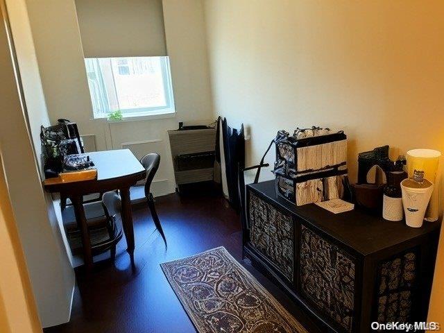 6748 Springfield Boulevard, Unit 1 Queens, NY 11364 - Photo 6 of 7 a view of a workspace with furniture and a window