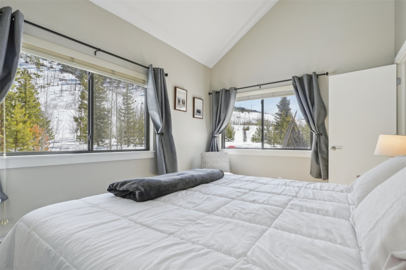 1944 Soda Ridge Road, Unit 1228 Keystone, CO 80435 - Photo 21 of 46 Bedroom with multiple windows and lofted ceiling