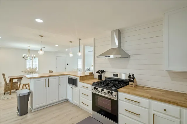 a kitchen with a stove and cabinets