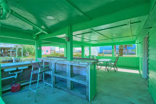 a view of an chairs and table in patio