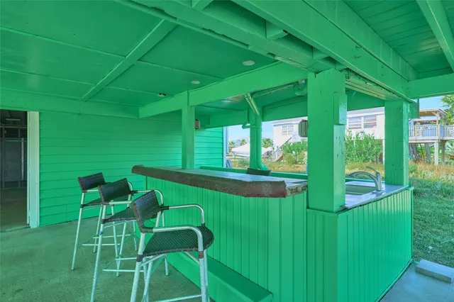 a view of balcony with a table and chairs