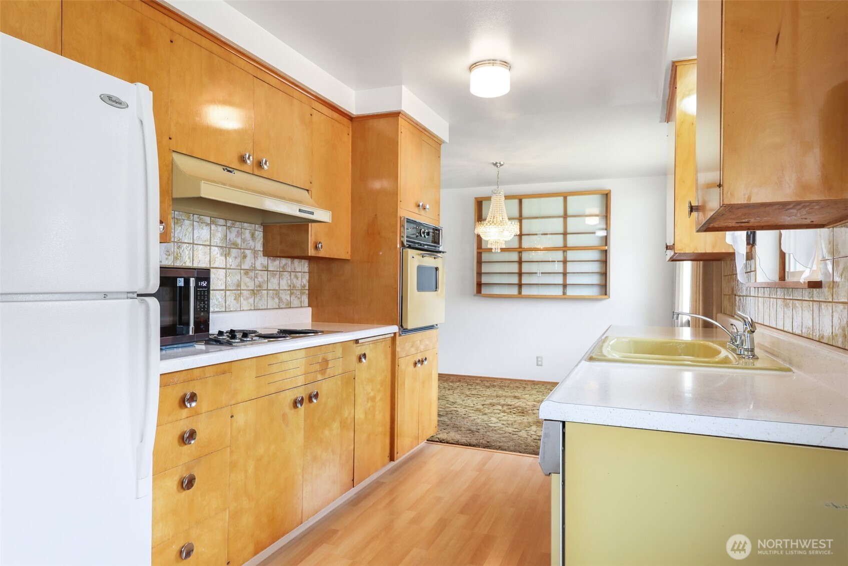7304 Beverly Boulevard Everett, WA 98203 - Photo 16 of 38 a kitchen with stainless steel appliances a sink stove and cabinets