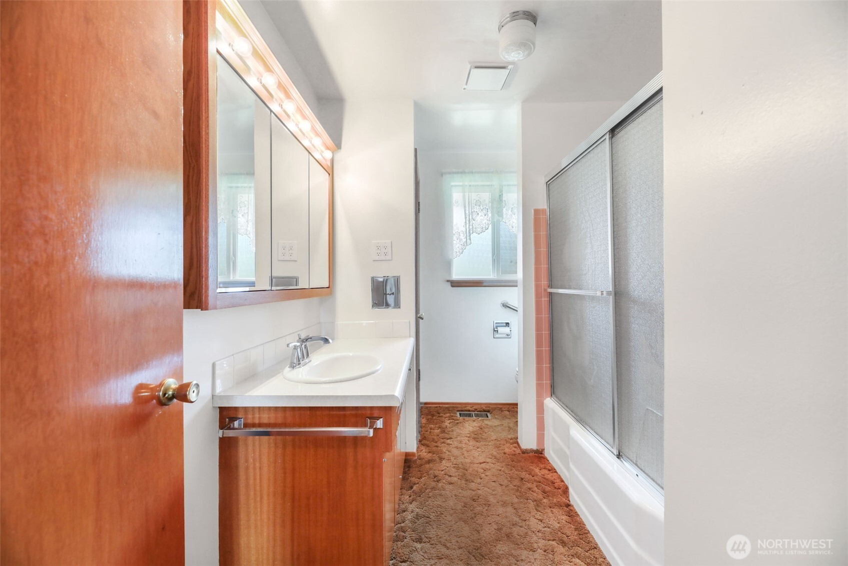 7304 Beverly Boulevard Everett, WA 98203 - Photo 17 of 38 a bathroom with a sink and a mirror