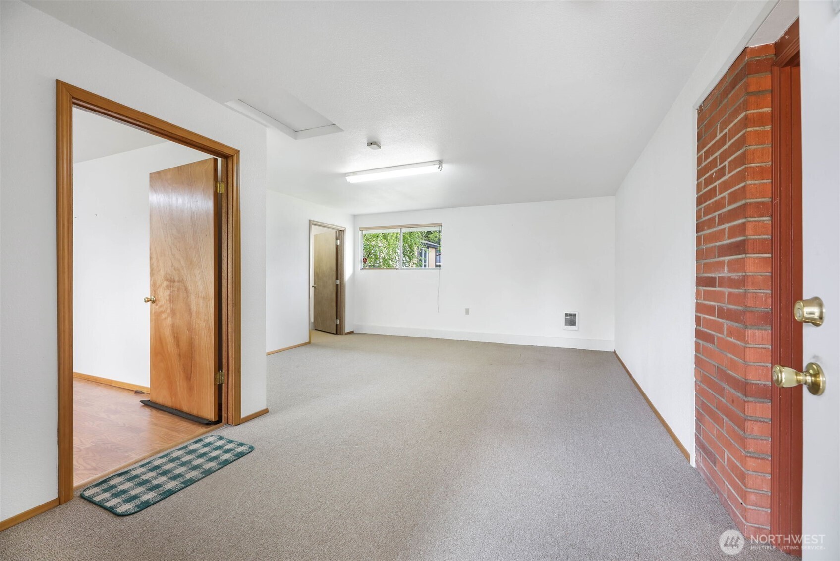 7304 Beverly Boulevard Everett, WA 98203 - Photo 23 of 38 an empty room with windows